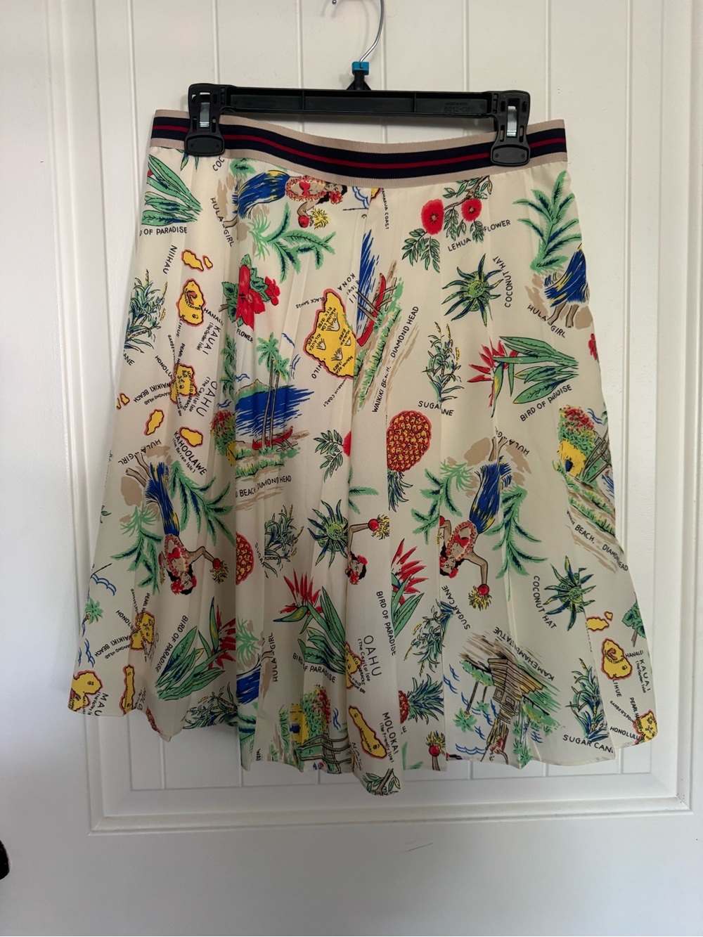 JCrew, size 8, never been used, creamy polyester midi skirt with tropical theme.